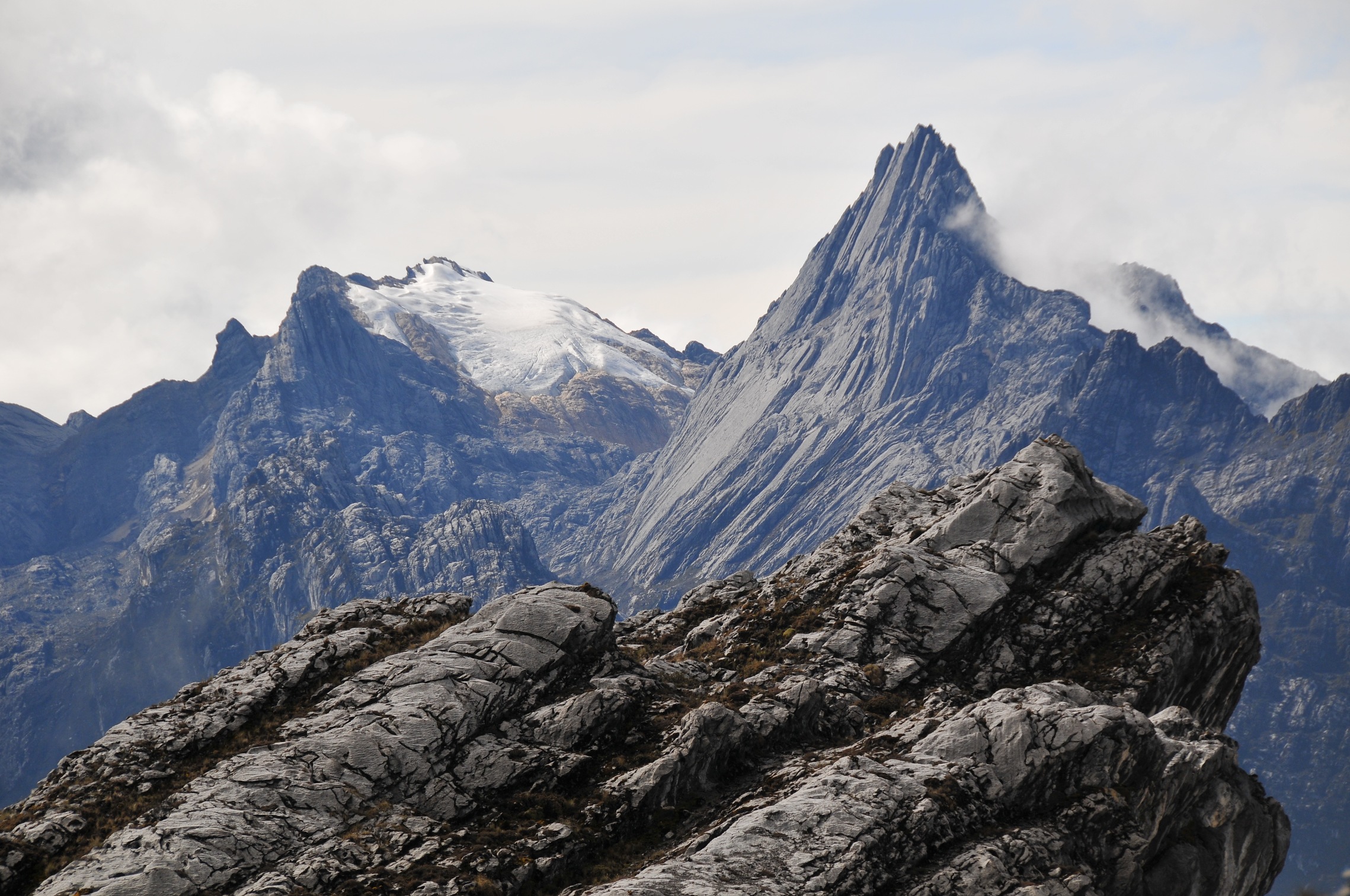 Carstensz Pyramid towering with permanent snow and sharp rock formations in Papua, Indonesia.